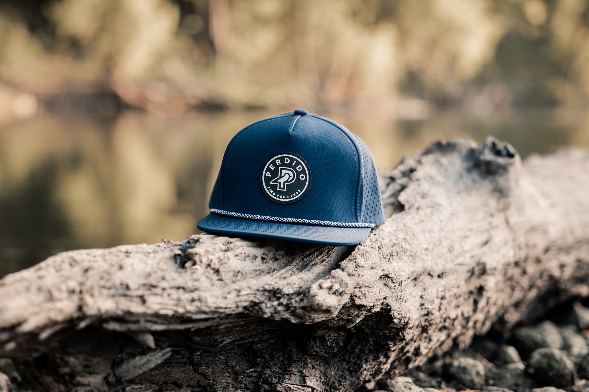 Navy water resistant five panel snapback with black and white rubber perdido patch