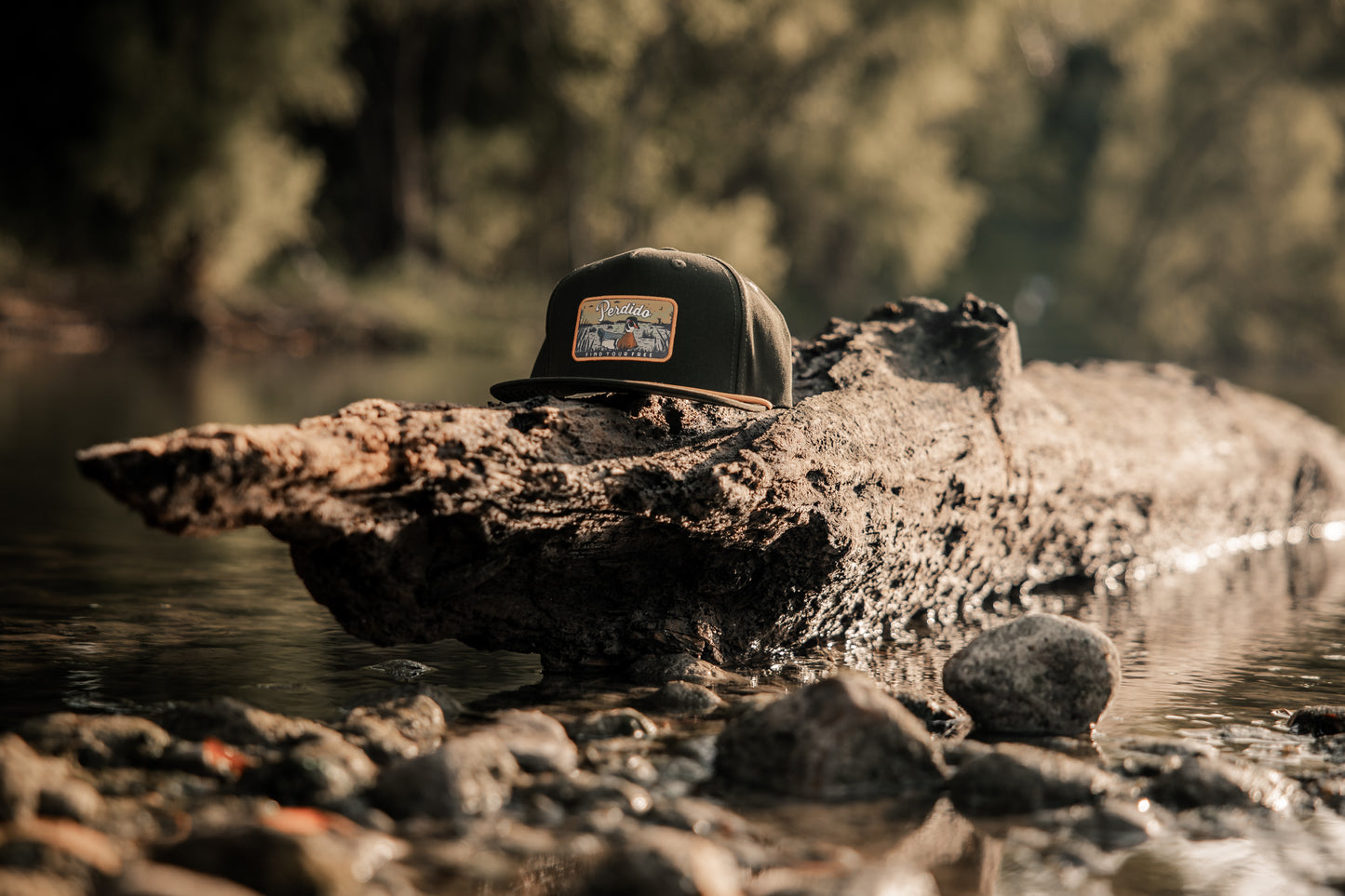 Green cotton five panel snapback with wood duck printed patch.
